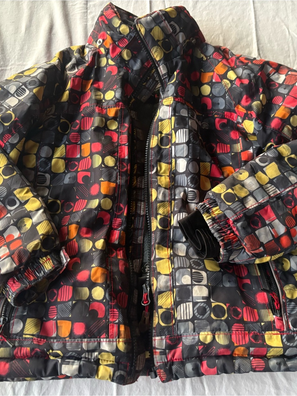 Kamik Kids' Black Jacket with Red & Yellow Dot-Grid Print